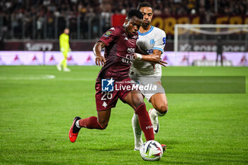 2023-08-18 - Malick MBAYE of Metz and Renan LODI of Marseille during the French championship Ligue 1 football match between FC Metz and Olympique de Marseille on August 18, 2023 at Saint-Symphorien stadium in Metz, France - FOOTBALL - FRENCH CHAMP - METZ V MARSEILLE - FRENCH LIGUE 1 - SOCCER
