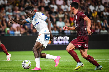 2023-08-18 - Ismaila SARR of Marseille and Maxime COLIN of Metz during the French championship Ligue 1 football match between FC Metz and Olympique de Marseille on August 18, 2023 at Saint-Symphorien stadium in Metz, France - FOOTBALL - FRENCH CHAMP - METZ V MARSEILLE - FRENCH LIGUE 1 - SOCCER