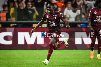 2023-08-18 - Cheikh SABALY of Metz celebrates his goal during the French championship Ligue 1 football match between FC Metz and Olympique de Marseille on August 18, 2023 at Saint-Symphorien stadium in Metz, France - FOOTBALL - FRENCH CHAMP - METZ V MARSEILLE - FRENCH LIGUE 1 - SOCCER