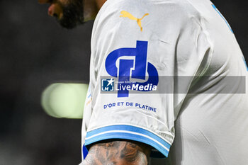 2023-08-18 - Logo of the official partner (D'or et de platine, brand belonging to the rapper JUL) of Marseille during the French championship Ligue 1 football match between FC Metz and Olympique de Marseille on August 18, 2023 at Saint-Symphorien stadium in Metz, France - FOOTBALL - FRENCH CHAMP - METZ V MARSEILLE - FRENCH LIGUE 1 - SOCCER