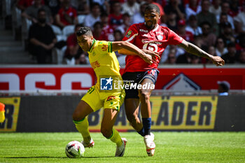 2023-08-20 - Mostafa MOHAMED of Nantes and Alexsandro VICTOR DE SOUZA RIBEIRO of Lille during the French championship Ligue 1 football match between LOSC Lille and FC Nantes on August 20, 2023 at Pierre Mauroy stadium in Villeneuve-d'Ascq near Lille, France - FOOTBALL - FRENCH CHAMP - LILLE V NANTES - FRENCH LIGUE 1 - SOCCER