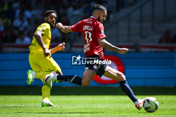 2023-08-20 - Jean-Charles CASTELLETTO of Nantes and Remy CABELLA of Lille during the French championship Ligue 1 football match between LOSC Lille and FC Nantes on August 20, 2023 at Pierre Mauroy stadium in Villeneuve-d'Ascq near Lille, France - FOOTBALL - FRENCH CHAMP - LILLE V NANTES - FRENCH LIGUE 1 - SOCCER