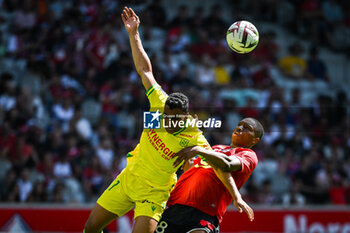 2023-08-20 - Mostafa MOHAMED of Nantes and Bafode DIAKITE of Lille during the French championship Ligue 1 football match between LOSC Lille and FC Nantes on August 20, 2023 at Pierre Mauroy stadium in Villeneuve-d'Ascq near Lille, France - FOOTBALL - FRENCH CHAMP - LILLE V NANTES - FRENCH LIGUE 1 - SOCCER