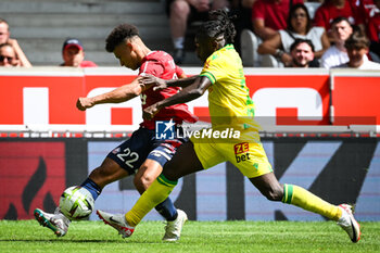 2023-08-20 - Tiago SANTOS of Lille and Moses SIMON of Nantes during the French championship Ligue 1 football match between LOSC Lille and FC Nantes on August 20, 2023 at Pierre Mauroy stadium in Villeneuve-d'Ascq near Lille, France - FOOTBALL - FRENCH CHAMP - LILLE V NANTES - FRENCH LIGUE 1 - SOCCER
