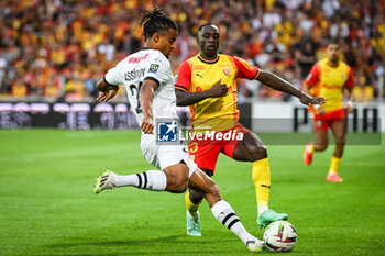 2023-08-20 - Lorenz ASSIGNON of Rennes and Deiver MACHADO of Lens during the French championship Ligue 1 football match between RC Lens and Stade Rennais (Rennes) on August 20, 2023 at Bollaert-Delelis stadium in Lens, France - FOOTBALL - FRENCH CHAMP - LENS V RENNES - FRENCH LIGUE 1 - SOCCER