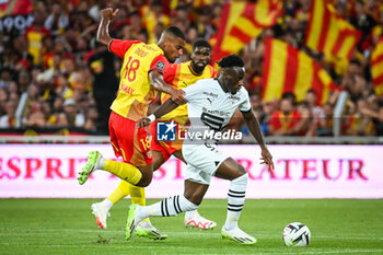 2023-08-20 - Andy DIOUF of Lens and Arnaud KALIMUENDO of Rennes during the French championship Ligue 1 football match between RC Lens and Stade Rennais (Rennes) on August 20, 2023 at Bollaert-Delelis stadium in Lens, France - FOOTBALL - FRENCH CHAMP - LENS V RENNES - FRENCH LIGUE 1 - SOCCER
