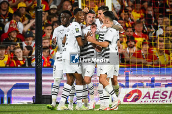 2023-08-20 - Benjamin BOURIGEAUD of Rennes celebrate his goal with teammates during the French championship Ligue 1 football match between RC Lens and Stade Rennais (Rennes) on August 20, 2023 at Bollaert-Delelis stadium in Lens, France - FOOTBALL - FRENCH CHAMP - LENS V RENNES - FRENCH LIGUE 1 - SOCCER