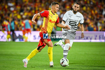 2023-08-20 - Przemyslaw Adam FRANKOWSKI of Lens and Amine GOUIRI of Rennes during the French championship Ligue 1 football match between RC Lens and Stade Rennais (Rennes) on August 20, 2023 at Bollaert-Delelis stadium in Lens, France - FOOTBALL - FRENCH CHAMP - LENS V RENNES - FRENCH LIGUE 1 - SOCCER