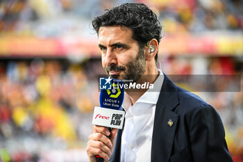 2023-08-20 - Alexandre RUIZ with an Free Ligua 1 microphone during the French championship Ligue 1 football match between RC Lens and Stade Rennais (Rennes) on August 20, 2023 at Bollaert-Delelis stadium in Lens, France - FOOTBALL - FRENCH CHAMP - LENS V RENNES - FRENCH LIGUE 1 - SOCCER