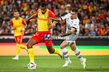 2023-08-20 - Andy DIOUF of Lens and Baptiste SANTAMARIA of Rennes during the French championship Ligue 1 football match between RC Lens and Stade Rennais (Rennes) on August 20, 2023 at Bollaert-Delelis stadium in Lens, France - FOOTBALL - FRENCH CHAMP - LENS V RENNES - FRENCH LIGUE 1 - SOCCER