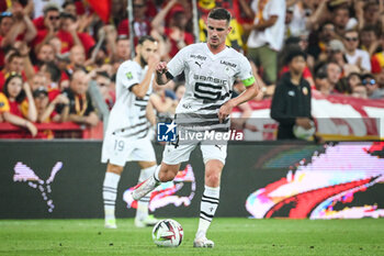 2023-08-20 - Benjamin BOURIGEAUD of Rennes during the French championship Ligue 1 football match between RC Lens and Stade Rennais (Rennes) on August 20, 2023 at Bollaert-Delelis stadium in Lens, France - FOOTBALL - FRENCH CHAMP - LENS V RENNES - FRENCH LIGUE 1 - SOCCER