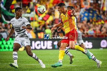 2023-08-20 - Warmed OMARI of Rennes and Florian SOTOCA of Lens during the French championship Ligue 1 football match between RC Lens and Stade Rennais (Rennes) on August 20, 2023 at Bollaert-Delelis stadium in Lens, France - FOOTBALL - FRENCH CHAMP - LENS V RENNES - FRENCH LIGUE 1 - SOCCER