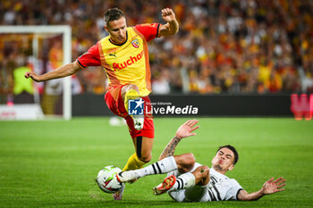 2023-08-20 - Przemyslaw Adam FRANKOWSKI of Lens and Enzo LE FEE of Rennes during the French championship Ligue 1 football match between RC Lens and Stade Rennais (Rennes) on August 20, 2023 at Bollaert-Delelis stadium in Lens, France - FOOTBALL - FRENCH CHAMP - LENS V RENNES - FRENCH LIGUE 1 - SOCCER
