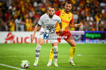 2023-08-20 - Amine GOUIRI of Rennes and Jonathan GRADIT of Lens during the French championship Ligue 1 football match between RC Lens and Stade Rennais (Rennes) on August 20, 2023 at Bollaert-Delelis stadium in Lens, France - FOOTBALL - FRENCH CHAMP - LENS V RENNES - FRENCH LIGUE 1 - SOCCER