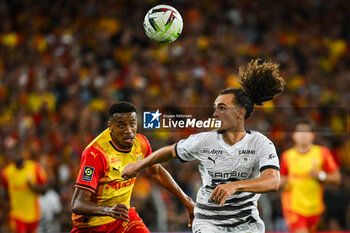 2023-08-20 - Morgan GUILAVOGUI of Lens and Arthur THEATE of Rennes during the French championship Ligue 1 football match between RC Lens and Stade Rennais (Rennes) on August 20, 2023 at Bollaert-Delelis stadium in Lens, France - FOOTBALL - FRENCH CHAMP - LENS V RENNES - FRENCH LIGUE 1 - SOCCER