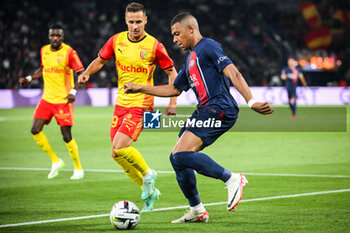 2023-08-26 - Przemyslaw Adam FRANKOWSKI of Lens and Kylian MBAPPE of PSG during the French championship Ligue 1 football match between Paris Saint-Germain and RC Lens on August 26, 2023 at Parc des Princes stadium in Paris, France - FOOTBALL - FRENCH CHAMP - PARIS SG V LENS - FRENCH LIGUE 1 - SOCCER