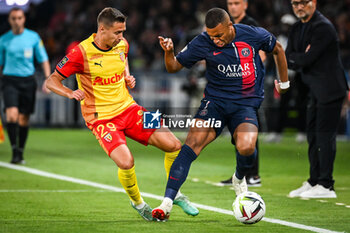 2023-08-26 - Przemyslaw Adam FRANKOWSKI of Lens and Kylian MBAPPE of PSG during the French championship Ligue 1 football match between Paris Saint-Germain and RC Lens on August 26, 2023 at Parc des Princes stadium in Paris, France - FOOTBALL - FRENCH CHAMP - PARIS SG V LENS - FRENCH LIGUE 1 - SOCCER