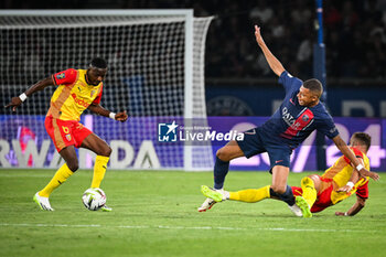 2023-08-26 - Salis Abdul SAMED of Lens, Kylian MBAPPE of PSG and Jonathan GRADIT of Lens during the French championship Ligue 1 football match between Paris Saint-Germain and RC Lens on August 26, 2023 at Parc des Princes stadium in Paris, France - FOOTBALL - FRENCH CHAMP - PARIS SG V LENS - FRENCH LIGUE 1 - SOCCER