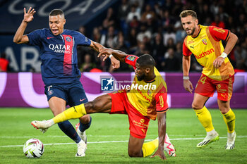 2023-08-26 - Kylian MBAPPE of PSG, Kevin DANSO of Lens and Jonathan GRADIT of Lens during the French championship Ligue 1 football match between Paris Saint-Germain and RC Lens on August 26, 2023 at Parc des Princes stadium in Paris, France - FOOTBALL - FRENCH CHAMP - PARIS SG V LENS - FRENCH LIGUE 1 - SOCCER