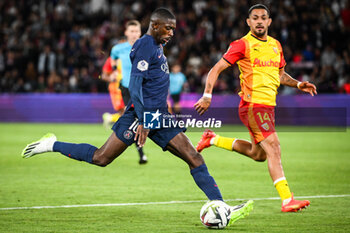 2023-08-26 - Ousmane DEMBELE of PSG and Facundo Axel MEDINA of Lens during the French championship Ligue 1 football match between Paris Saint-Germain and RC Lens on August 26, 2023 at Parc des Princes stadium in Paris, France - FOOTBALL - FRENCH CHAMP - PARIS SG V LENS - FRENCH LIGUE 1 - SOCCER