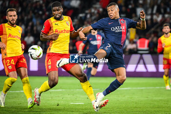 2023-08-26 - Kevin DANSO of Lens and Kylian MBAPPE of PSG during the French championship Ligue 1 football match between Paris Saint-Germain and RC Lens on August 26, 2023 at Parc des Princes stadium in Paris, France - FOOTBALL - FRENCH CHAMP - PARIS SG V LENS - FRENCH LIGUE 1 - SOCCER