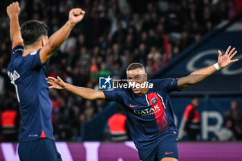 2023-08-26 - Kylian MBAPPE of PSG celebrate his goal with Marco ASENSIO of PSG during the French championship Ligue 1 football match between Paris Saint-Germain and RC Lens on August 26, 2023 at Parc des Princes stadium in Paris, France - FOOTBALL - FRENCH CHAMP - PARIS SG V LENS - FRENCH LIGUE 1 - SOCCER