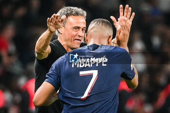 2023-08-26 - Kylian MBAPPE of PSG celebrate his goal with Luis ENRIQUE of PSG during the French championship Ligue 1 football match between Paris Saint-Germain and RC Lens on August 26, 2023 at Parc des Princes stadium in Paris, France - FOOTBALL - FRENCH CHAMP - PARIS SG V LENS - FRENCH LIGUE 1 - SOCCER