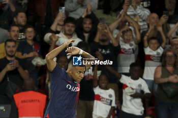 2023-08-27 - Kylian Mbappe of PSG celebrates his first goal during the French championship Ligue 1 football match between Paris Saint-Germain (PSG) and RC Lens (RCL) on August 26, 2023 at Parc des Princes stadium in Paris, France - FOOTBALL - FRENCH CHAMP - PARIS SG V LENS - FRENCH LIGUE 1 - SOCCER