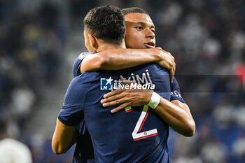 2023-09-03 - Achraf HAKIMI of PSG celebrate his goal with Kylian MBAPPE of PSG during the French championship Ligue 1 football match between Olympique Lyonnais (Lyon) and Paris Saint-Germain on September 3, 2023 at Groupama stadium in Decines-Charpieu near Lyon, France - FOOTBALL - FRENCH CHAMP - LYON V PARIS SG - FRENCH LIGUE 1 - SOCCER