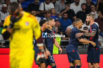 2023-09-03 - Kylian MBAPPE of PSG celebrate his goal with Milan SKRINIAR of PSG, Warren ZAIRE-EMERY of PSG, Lucas HERNANDEZ of PSG and Anthony LOPES of Lyon looks dejected during the French championship Ligue 1 football match between Olympique Lyonnais (Lyon) and Paris Saint-Germain on September 3, 2023 at Groupama stadium in Decines-Charpieu near Lyon, France - FOOTBALL - FRENCH CHAMP - LYON V PARIS SG - FRENCH LIGUE 1 - SOCCER