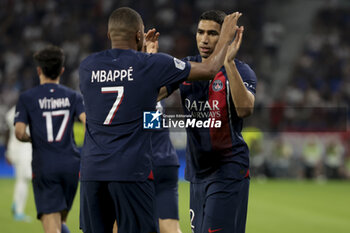 2023-09-03 - Kylian Mbappe of PSG celebrates his goal with Achraf Hakimi during the French championship Ligue 1 football match between Olympique Lyonnais (Lyon, OL) and Paris Saint-Germain (PSG) on September 3, 2023 at Groupama stadium in Decines-Charpieu near Lyon, France - FOOTBALL - FRENCH CHAMP - LYON V PARIS SG - FRENCH LIGUE 1 - SOCCER