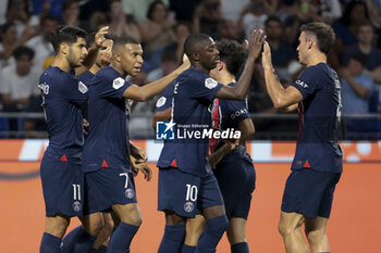 2023-09-03 - Kylian Mbappe of PSG celebrates his second goal with teammates during the French championship Ligue 1 football match between Olympique Lyonnais (Lyon, OL) and Paris Saint-Germain (PSG) on September 3, 2023 at Groupama stadium in Decines-Charpieu near Lyon, France - FOOTBALL - FRENCH CHAMP - LYON V PARIS SG - FRENCH LIGUE 1 - SOCCER