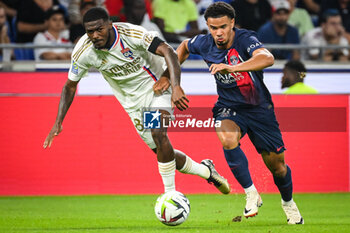 2023-09-03 - Ainsley MAITLAND-NILES of Lyon and Warren ZAIRE-EMERY of PSG during the French championship Ligue 1 football match between Olympique Lyonnais (Lyon) and Paris Saint-Germain on September 3, 2023 at Groupama stadium in Decines-Charpieu near Lyon, France - FOOTBALL - FRENCH CHAMP - LYON V PARIS SG - FRENCH LIGUE 1 - SOCCER