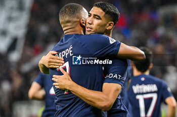 2023-09-03 - Kylian MBAPPE of PSG celebrate his goal with Achraf HAKIMI of PSG during the French championship Ligue 1 football match between Olympique Lyonnais (Lyon) and Paris Saint-Germain on September 3, 2023 at Groupama stadium in Decines-Charpieu near Lyon, France - FOOTBALL - FRENCH CHAMP - LYON V PARIS SG - FRENCH LIGUE 1 - SOCCER