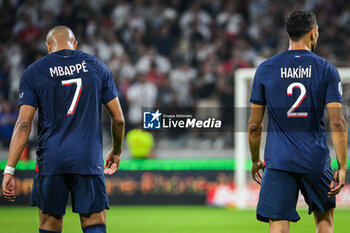 2023-09-03 - Kylian MBAPPE of PSG and Achraf HAKIMI of PSG during the French championship Ligue 1 football match between Olympique Lyonnais (Lyon) and Paris Saint-Germain on September 3, 2023 at Groupama stadium in Decines-Charpieu near Lyon, France - FOOTBALL - FRENCH CHAMP - LYON V PARIS SG - FRENCH LIGUE 1 - SOCCER