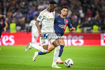 2023-09-03 - Sinaly DIOMANDE of Lyon and Warren ZAIRE-EMERY of PSG during the French championship Ligue 1 football match between Olympique Lyonnais (Lyon) and Paris Saint-Germain on September 3, 2023 at Groupama stadium in Decines-Charpieu near Lyon, France - FOOTBALL - FRENCH CHAMP - LYON V PARIS SG - FRENCH LIGUE 1 - SOCCER