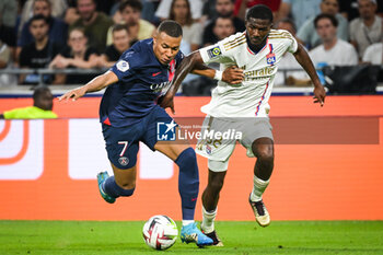 2023-09-03 - Kylian MBAPPE of PSG and Ainsley MAITLAND-NILES of Lyon during the French championship Ligue 1 football match between Olympique Lyonnais (Lyon) and Paris Saint-Germain on September 3, 2023 at Groupama stadium in Decines-Charpieu near Lyon, France - FOOTBALL - FRENCH CHAMP - LYON V PARIS SG - FRENCH LIGUE 1 - SOCCER
