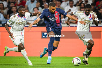 2023-09-03 - Clinton MATA of Lyon, Kylian MBAPPE of PSG and Ainsley MAITLAND-NILES of Lyon during the French championship Ligue 1 football match between Olympique Lyonnais (Lyon) and Paris Saint-Germain on September 3, 2023 at Groupama stadium in Decines-Charpieu near Lyon, France - FOOTBALL - FRENCH CHAMP - LYON V PARIS SG - FRENCH LIGUE 1 - SOCCER