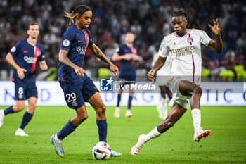 2023-09-03 - Bradley BARCOLA of PSG and Skelly ALVERO of Lyon during the French championship Ligue 1 football match between Olympique Lyonnais (Lyon) and Paris Saint-Germain on September 3, 2023 at Groupama stadium in Decines-Charpieu near Lyon, France - FOOTBALL - FRENCH CHAMP - LYON V PARIS SG - FRENCH LIGUE 1 - SOCCER