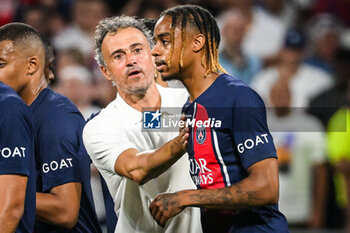 2023-09-03 - Luis ENRIQUE of PSG and Bradley BARCOLA of PSG during the French championship Ligue 1 football match between Olympique Lyonnais (Lyon) and Paris Saint-Germain on September 3, 2023 at Groupama stadium in Decines-Charpieu near Lyon, France - FOOTBALL - FRENCH CHAMP - LYON V PARIS SG - FRENCH LIGUE 1 - SOCCER