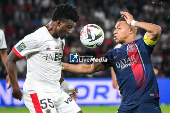 2023-09-15 - Youssouf NDAYISHIMIYE of Nice and Kylian MBAPPE of PSG during the French championship Ligue 1 football match between Paris Saint-Germain and OGC Nice on September 15, 2023 at Parc des Princes stadium in Paris, France - FOOTBALL - FRENCH CHAMP - PARIS SG V NICE - FRENCH LIGUE 1 - SOCCER