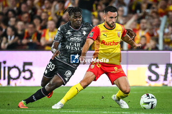 2023-09-16 - Joel ASORO of Metz and Adrien THOMASSON of Lens during the French championship Ligue 1 football match between RC Lens and FC Metz on September 16, 2023 at Felix Bollaert stadium in Lens, France - FOOTBALL - FRENCH CHAMP - LENS V METZ - FRENCH LIGUE 1 - SOCCER