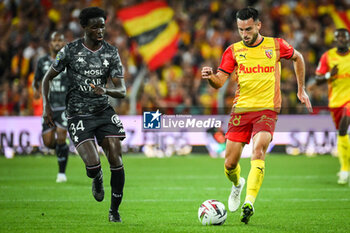 2023-09-16 - Joseph NDUQUIDI of Metz and Adrien THOMASSON of Lens during the French championship Ligue 1 football match between RC Lens and FC Metz on September 16, 2023 at Felix Bollaert stadium in Lens, France - FOOTBALL - FRENCH CHAMP - LENS V METZ - FRENCH LIGUE 1 - SOCCER