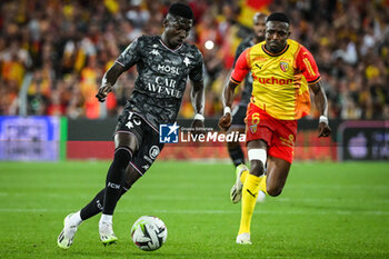 2023-09-16 - Lamine CAMARA of Metz and Salis Abdul SAMED of Lens during the French championship Ligue 1 football match between RC Lens and FC Metz on September 16, 2023 at Felix Bollaert stadium in Lens, France - FOOTBALL - FRENCH CHAMP - LENS V METZ - FRENCH LIGUE 1 - SOCCER