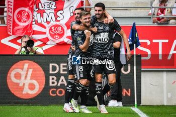 2023-09-17 - Pierre LEES-MELOU of Brest celebrate his goal with teammates during the French championship Ligue 1 football match between Stade De Reims and Stade Brestois on September 17, 2023 at Auguste Delaune stadium in Reims, France - FOOTBALL - FRENCH CHAMP - REIMS V BREST - FRENCH LIGUE 1 - SOCCER