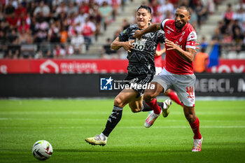 2023-09-17 - Martin SATRIANO of Brest and Yunis ABDELHAMID of Reims during the French championship Ligue 1 football match between Stade De Reims and Stade Brestois on September 17, 2023 at Auguste Delaune stadium in Reims, France - FOOTBALL - FRENCH CHAMP - REIMS V BREST - FRENCH LIGUE 1 - SOCCER