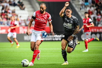 2023-09-17 - Martin SATRIANO of Brest and Yunis ABDELHAMID of Reims during the French championship Ligue 1 football match between Stade De Reims and Stade Brestois on September 17, 2023 at Auguste Delaune stadium in Reims, France - FOOTBALL - FRENCH CHAMP - REIMS V BREST - FRENCH LIGUE 1 - SOCCER