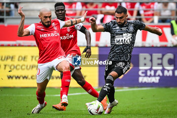 2023-09-17 - Teddy TEUMA of Reims, Azor MATUSIWA of Reims and Romain DEL CASTILLO of Brest during the French championship Ligue 1 football match between Stade De Reims and Stade Brestois on September 17, 2023 at Auguste Delaune stadium in Reims, France - FOOTBALL - FRENCH CHAMP - REIMS V BREST - FRENCH LIGUE 1 - SOCCER