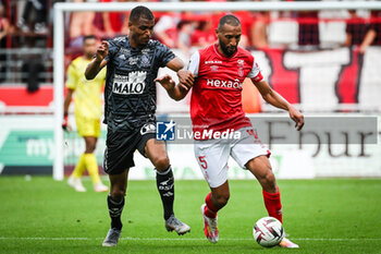 2023-09-17 - Steve MOUNIE of Brest and Yunis ABDELHAMID of Reims during the French championship Ligue 1 football match between Stade De Reims and Stade Brestois on September 17, 2023 at Auguste Delaune stadium in Reims, France - FOOTBALL - FRENCH CHAMP - REIMS V BREST - FRENCH LIGUE 1 - SOCCER