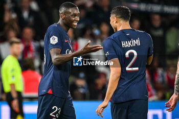 2023-09-24 - Randal KOLO MUANI of PSG celebrate his goal with Achraf HAKIMI of PSG during the French championship Ligue 1 football match between Paris Saint-Germain and Olympique de Marseille on September 24, 2023 at Parc des Princes stadium in Paris, France - FOOTBALL - FRENCH CHAMP - PARIS SG V MARSEILLE - FRENCH LIGUE 1 - SOCCER